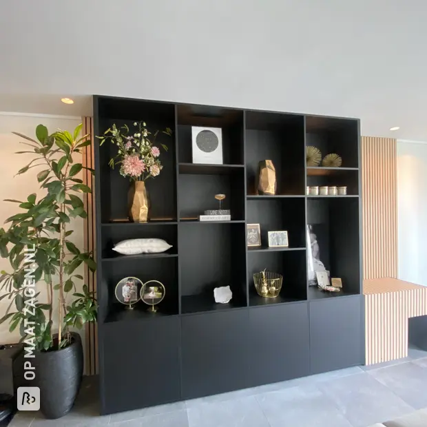 Black cupboard wall with open compartments and doors