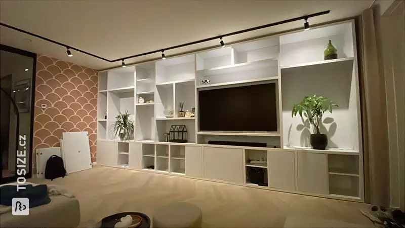 Custom-made TV shelving unit with doors, by Lars