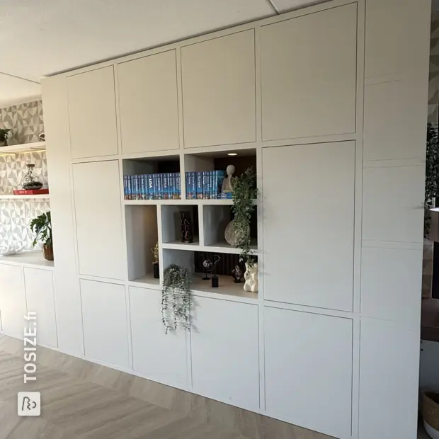 Cream wall unit with doors and open compartments