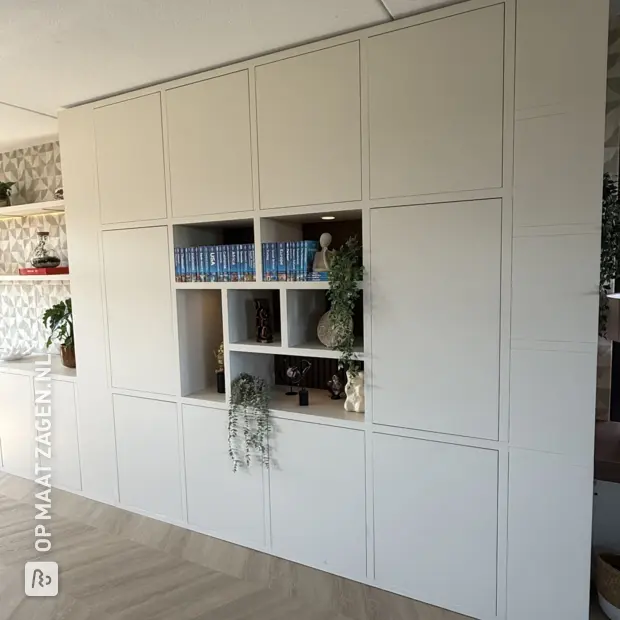 Cream wall unit with doors and open compartments
