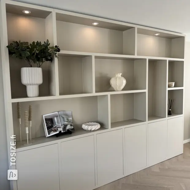 Cream wall unit with open compartments and doors
