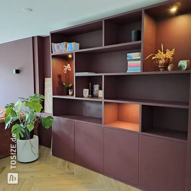 Brown wall unit with open compartments and doors