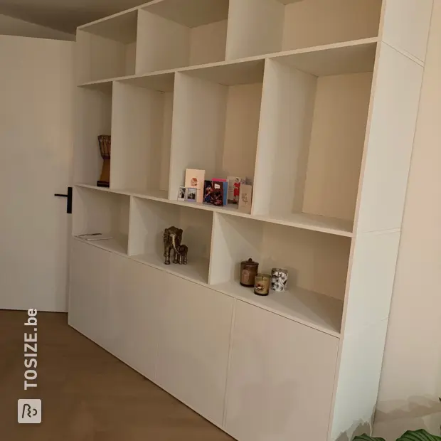White wall unit with open compartments and doors