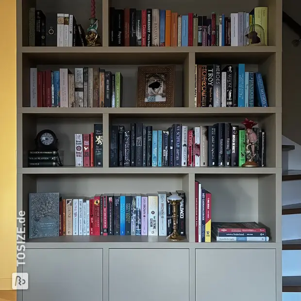 Cream bookcase with open compartments and doors