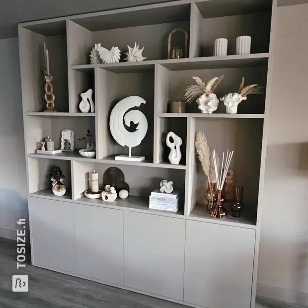 Grey wall unit with doors and open compartments