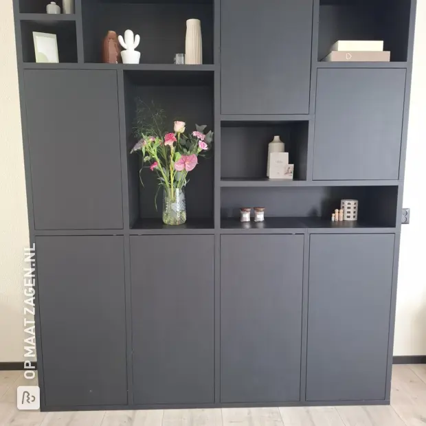 Black cabinet with doors and open compartments