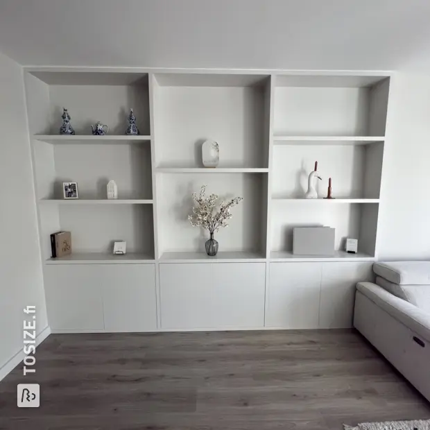 White wall unit with doors and open compartments