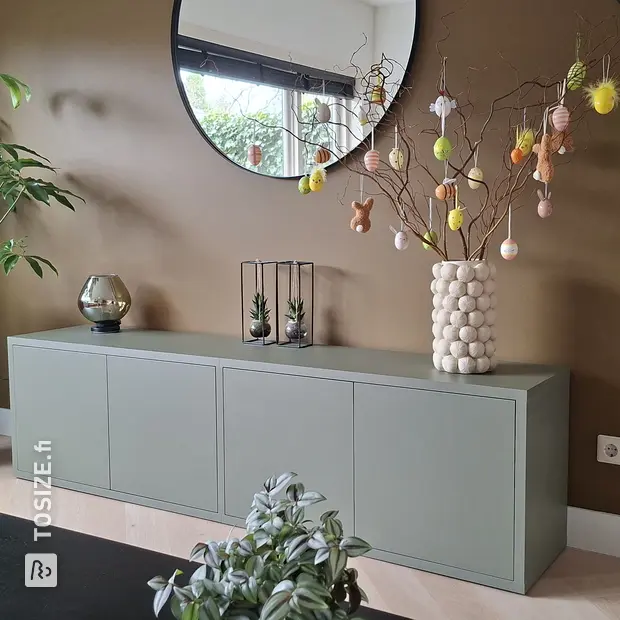 Green sideboard with doors and open compartments