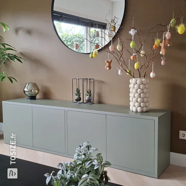 Green sideboard with doors and open compartments