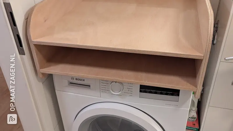 Praktisch aankleedkussen voor de wasmachine, door Robert