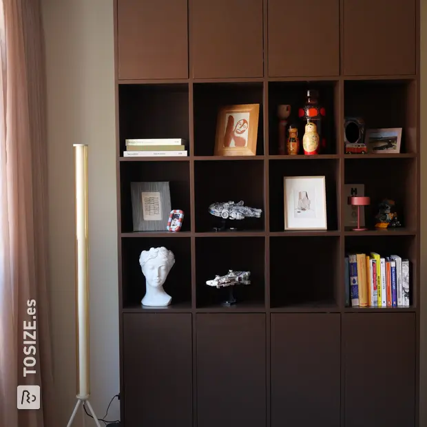 Dark wall unit with doors and open compartments