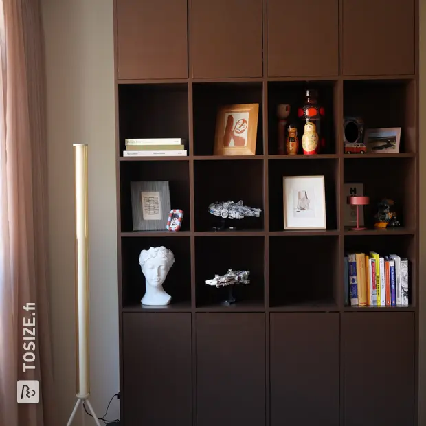 Dark wall unit with doors and open compartments