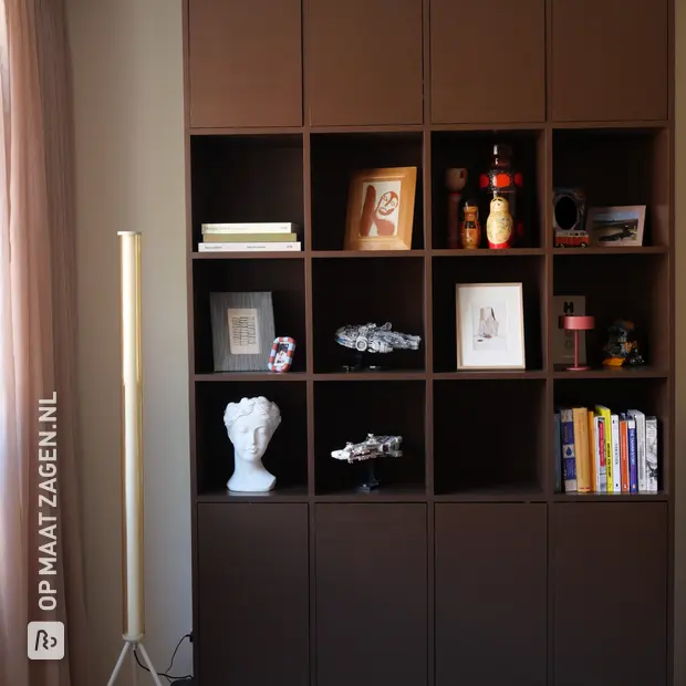 Dark wall unit with doors and open compartments