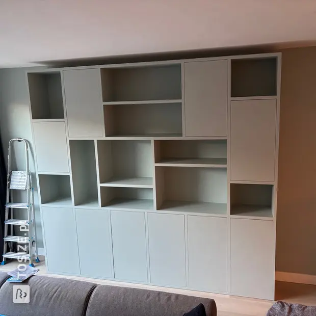 Light compartment cabinet with open compartments and doors