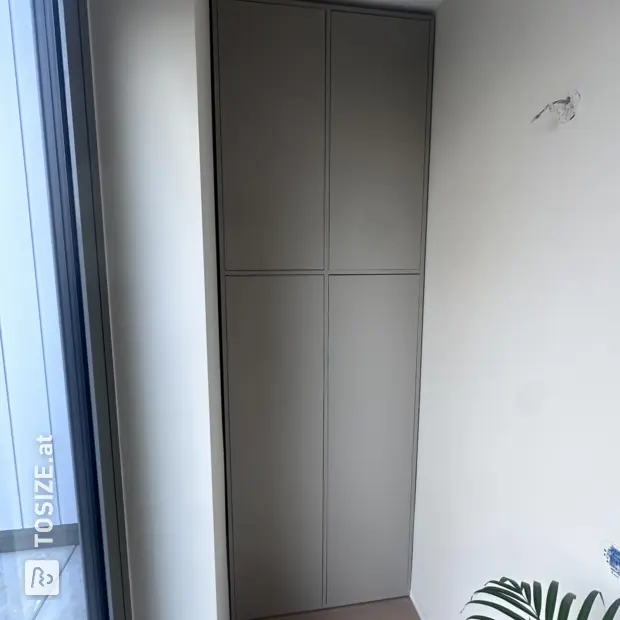 Grey wall unit with doors and open compartments