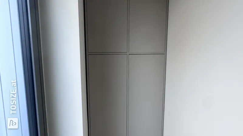 Custom-made cabinet in a hallway alcove by Frank