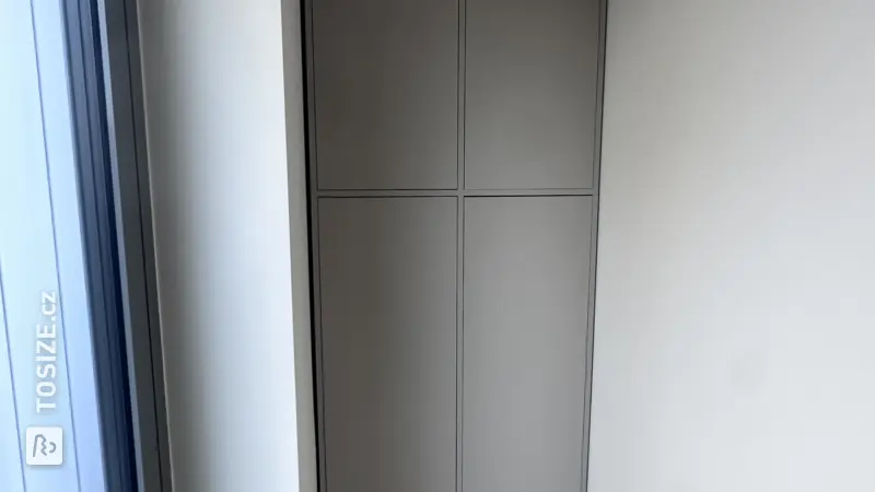 Custom-made cabinet in a hallway alcove by Frank