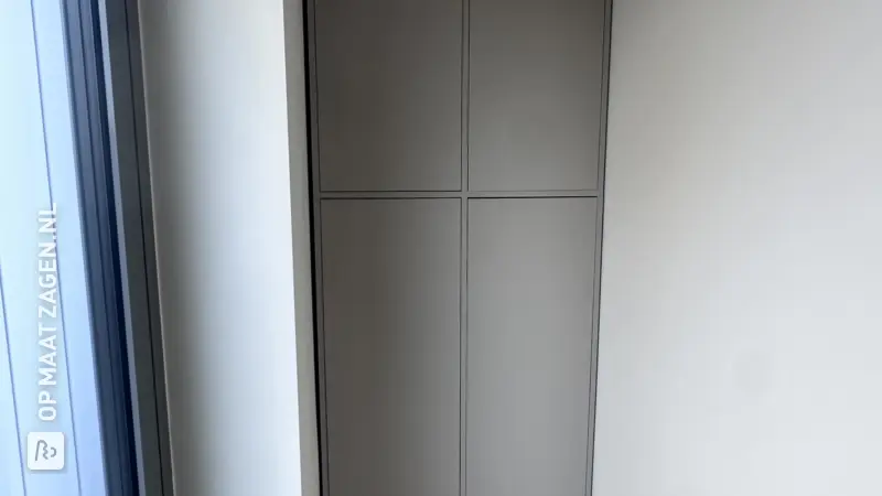 Custom-made cabinet in a hallway alcove by Frank