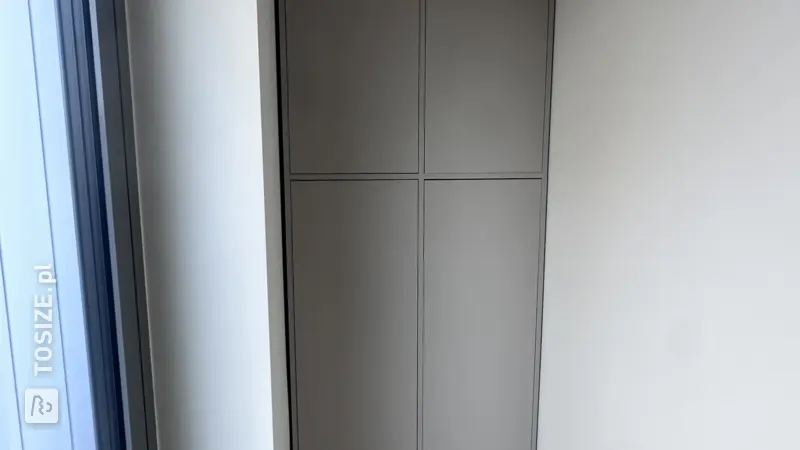 Custom-made cabinet in a hallway alcove by Frank