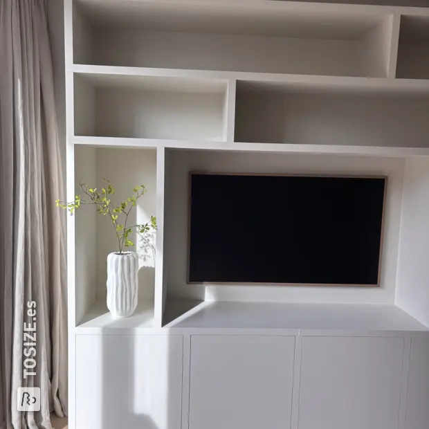 White cabinet with open compartments and doors