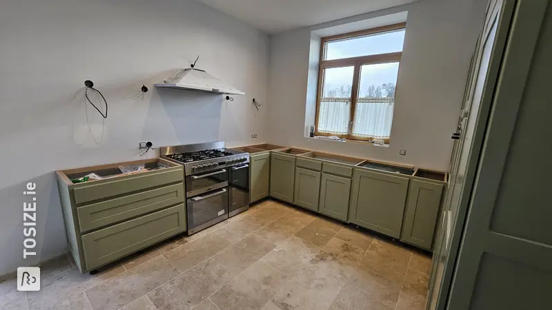 Kitchen cabinet door made of panels, by Laurie