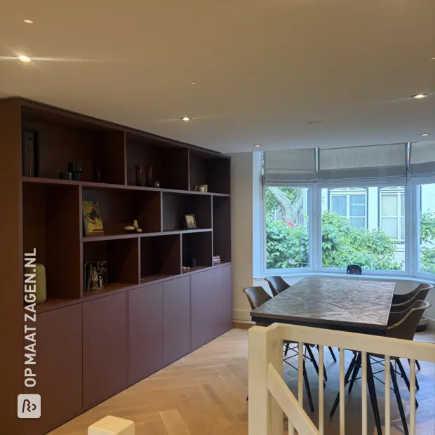 Red wall unit with open compartments and doors