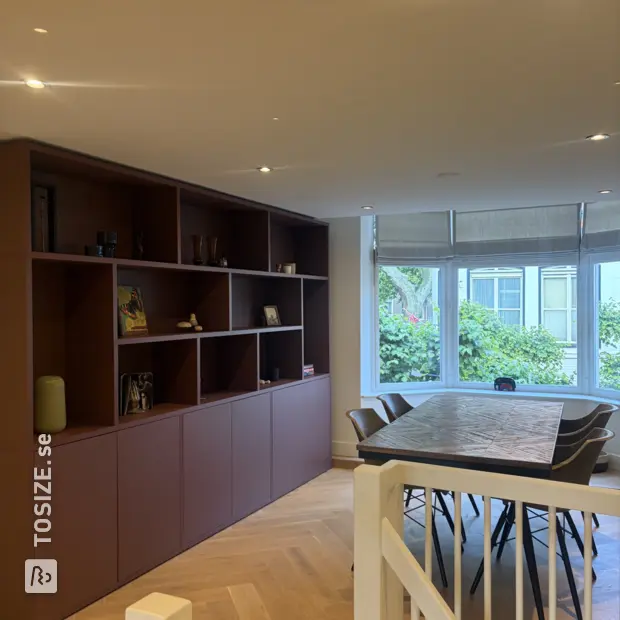 Red wall unit with open compartments and doors