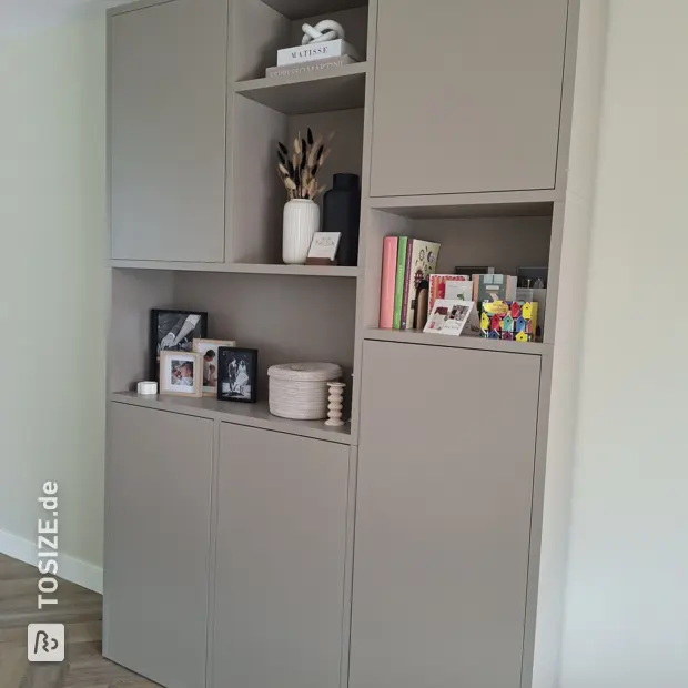Grey cabinet with doors and open compartments