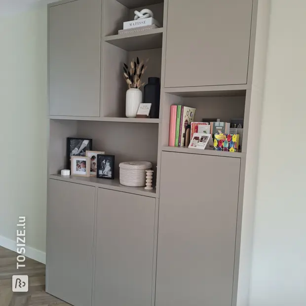 Grey cabinet with doors and open compartments