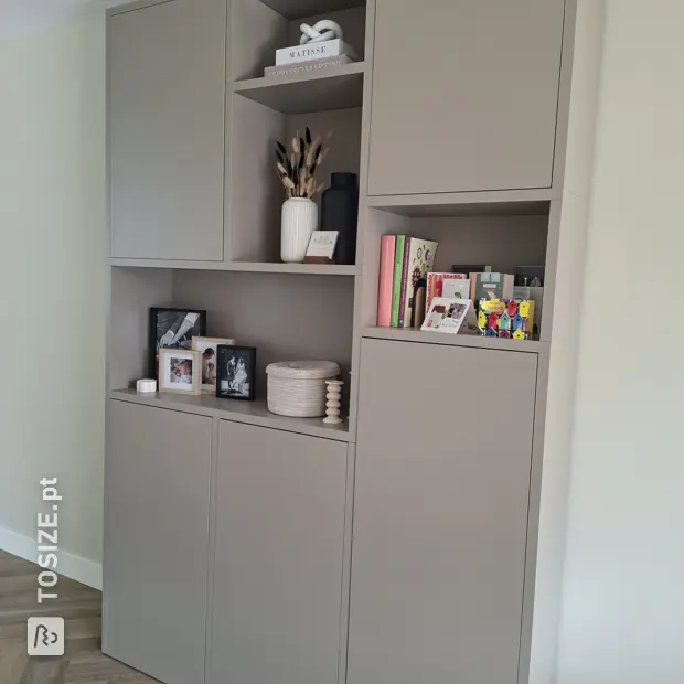 Grey cabinet with doors and open compartments