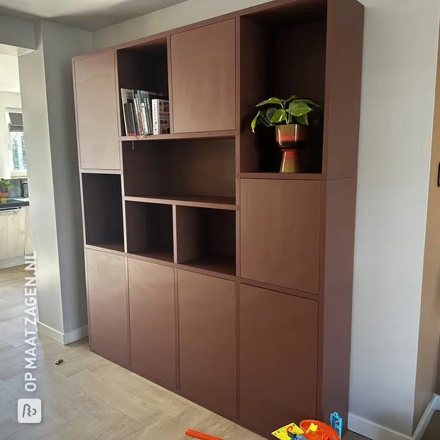 Brown wall unit with open compartments and doors