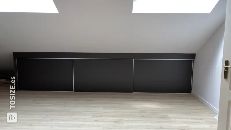 Custom-made sliding door wardrobe for a sloping wall, by Lucy
