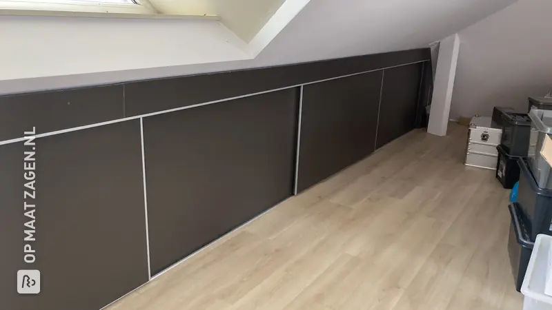 Custom-made sliding door wardrobe for a sloping wall, by Lucy