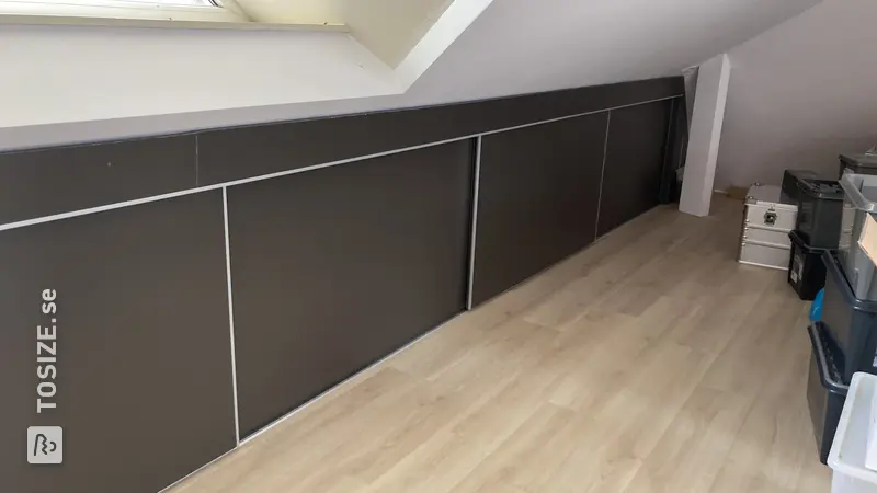 Custom-made sliding door wardrobe for a sloping wall, by Lucy
