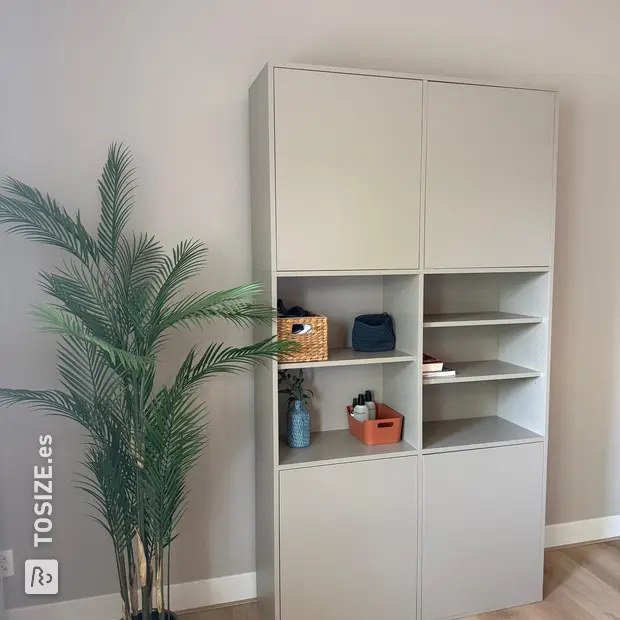 Cream wall unit with doors and open compartments