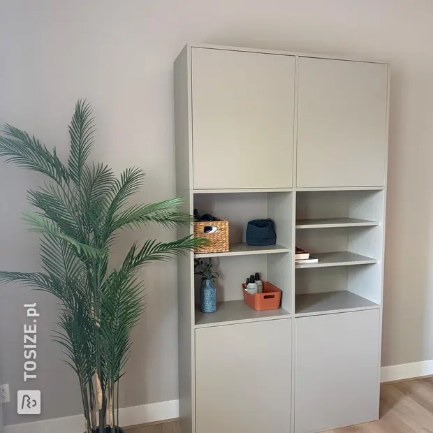 Cream wall unit with doors and open compartments