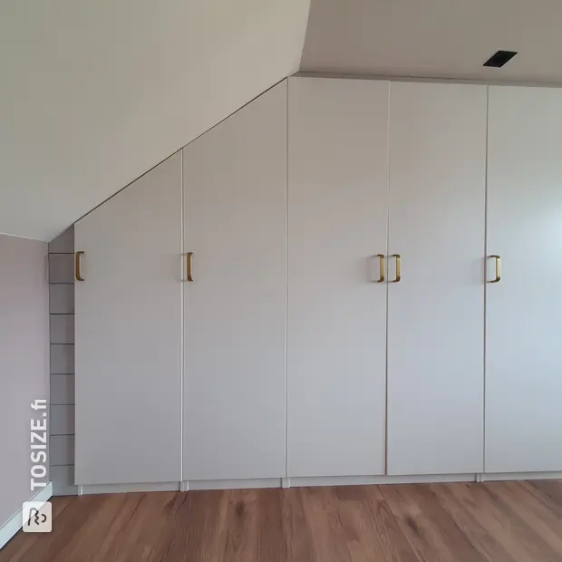 White cabinet with doors and open compartments