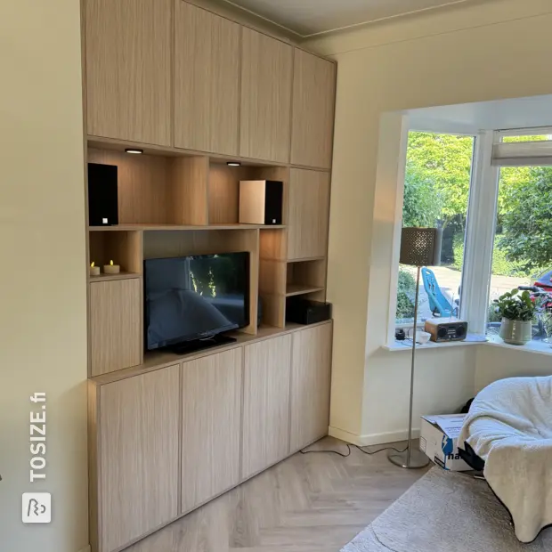 Natural wood cabinet wall with open compartments and doors
