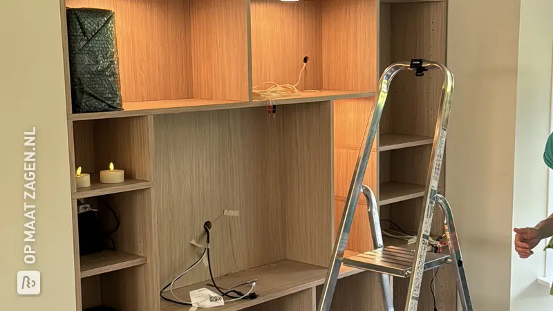 Custom-made oak TV cabinet with spotlights, by Lars