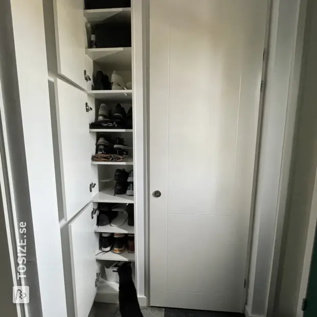 White shoe cabinet with doors and open compartments