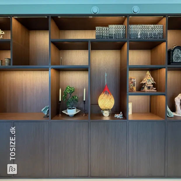 Dark wooden wall unit with open compartments and doors