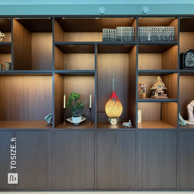 Dark wooden wall unit with open compartments and doors