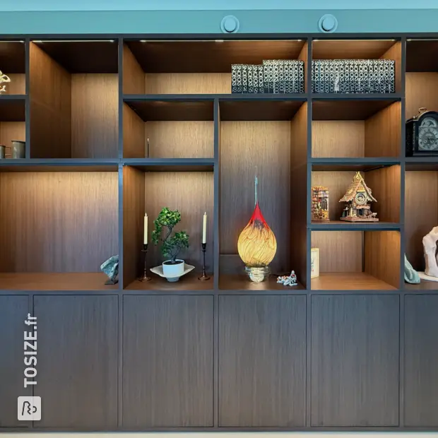 Dark wooden wall unit with open compartments and doors