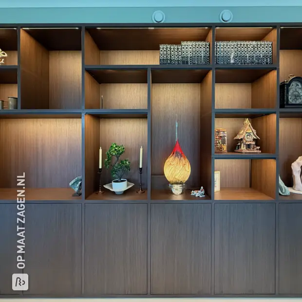Dark wooden wall unit with open compartments and doors