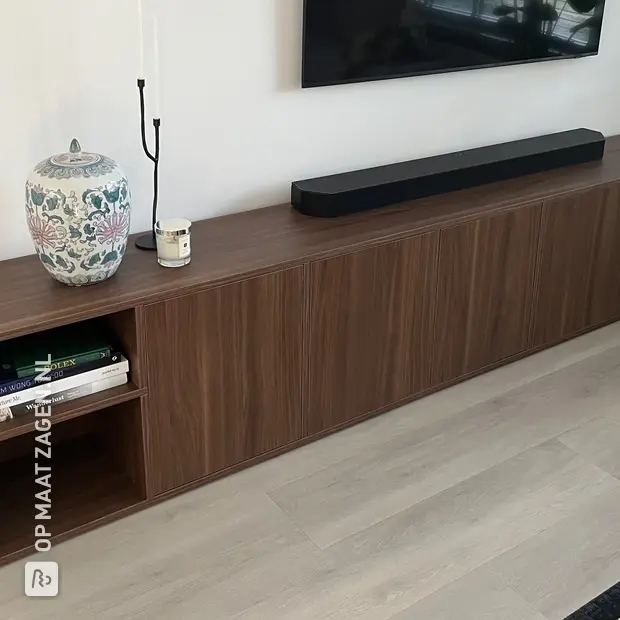Dark wooden TV cabinet with doors and open compartments