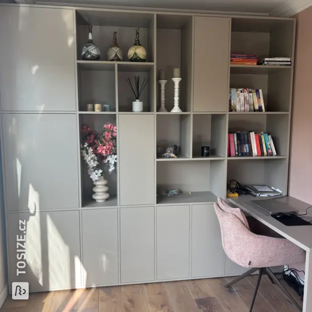 Grey cabinet with doors and open compartments