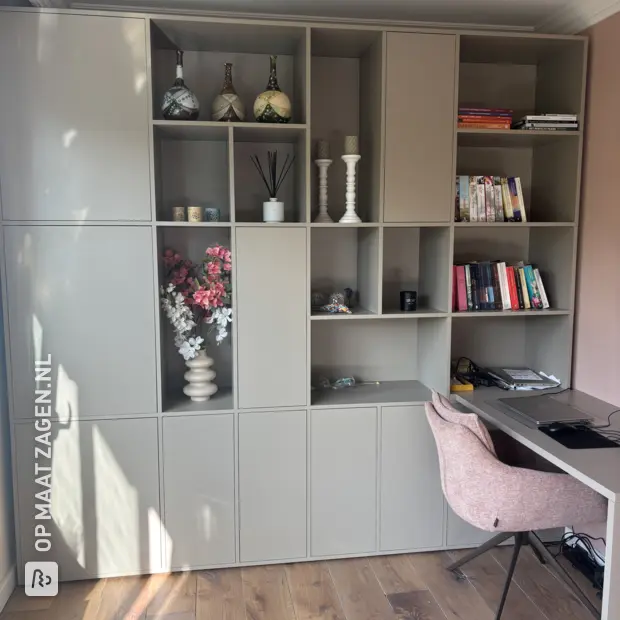 Grey cabinet with doors and open compartments