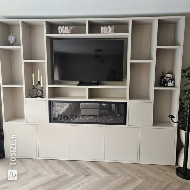Cream wall unit with open compartments and doors