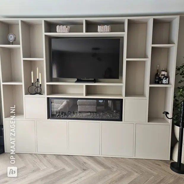 Cream wall unit with open compartments and doors
