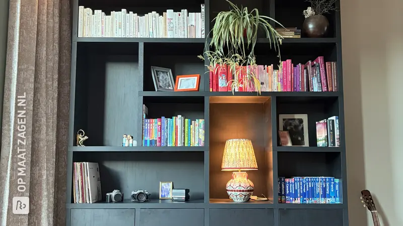 Homemade black bookcase for the living room, by Elizabeth